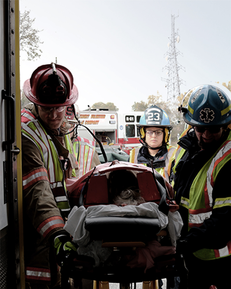 Emergency responders loading patient in to an ambulance