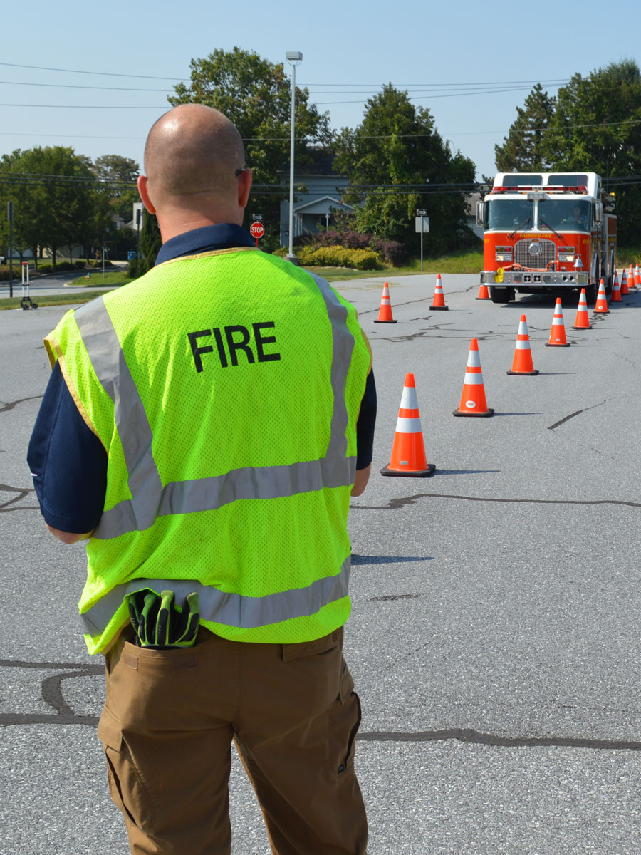 Firetruck driving through EVDT training cones