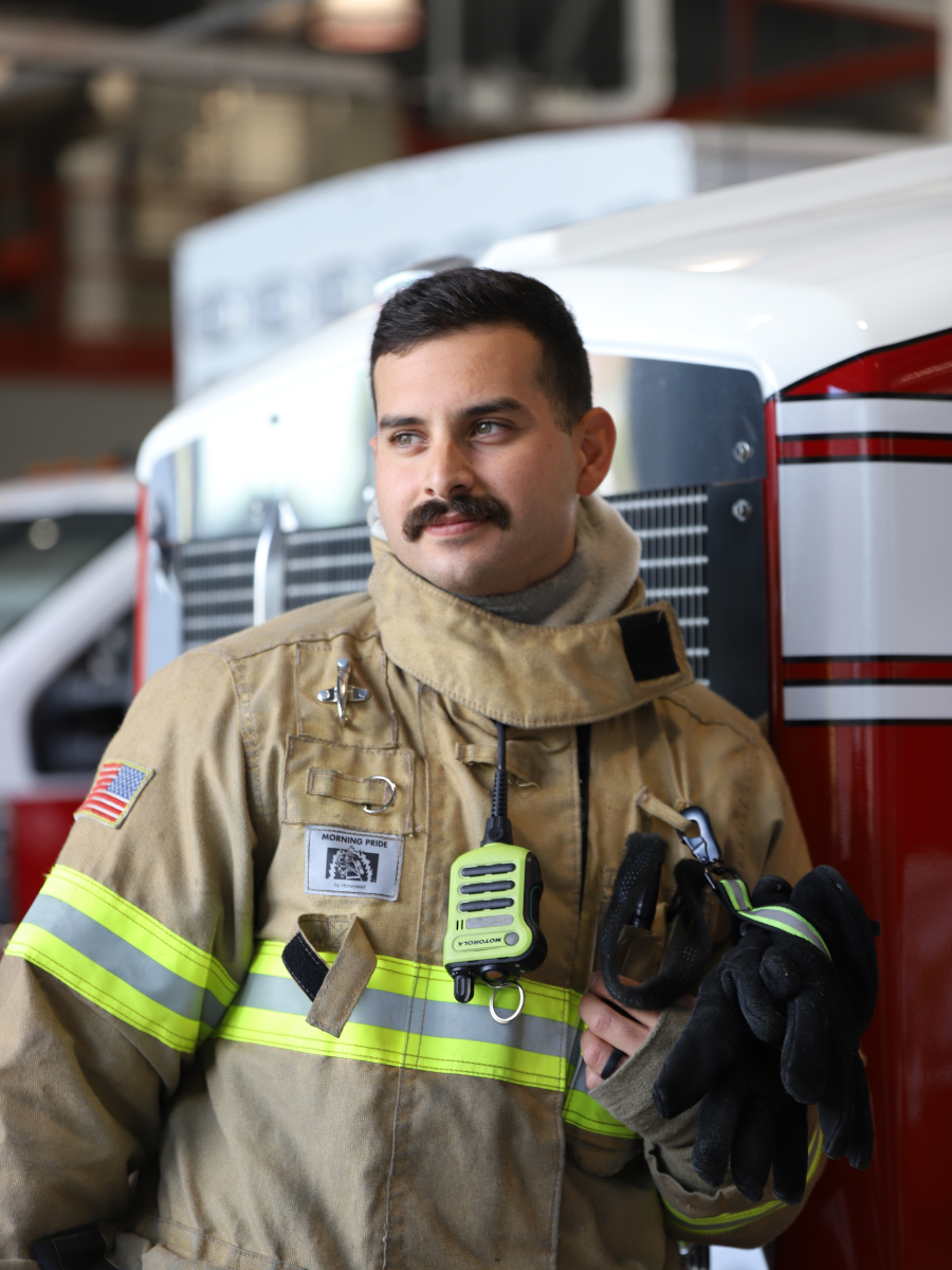 A firefighter standing in his gear