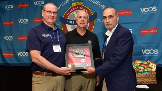 Firefighter sitting with their head down