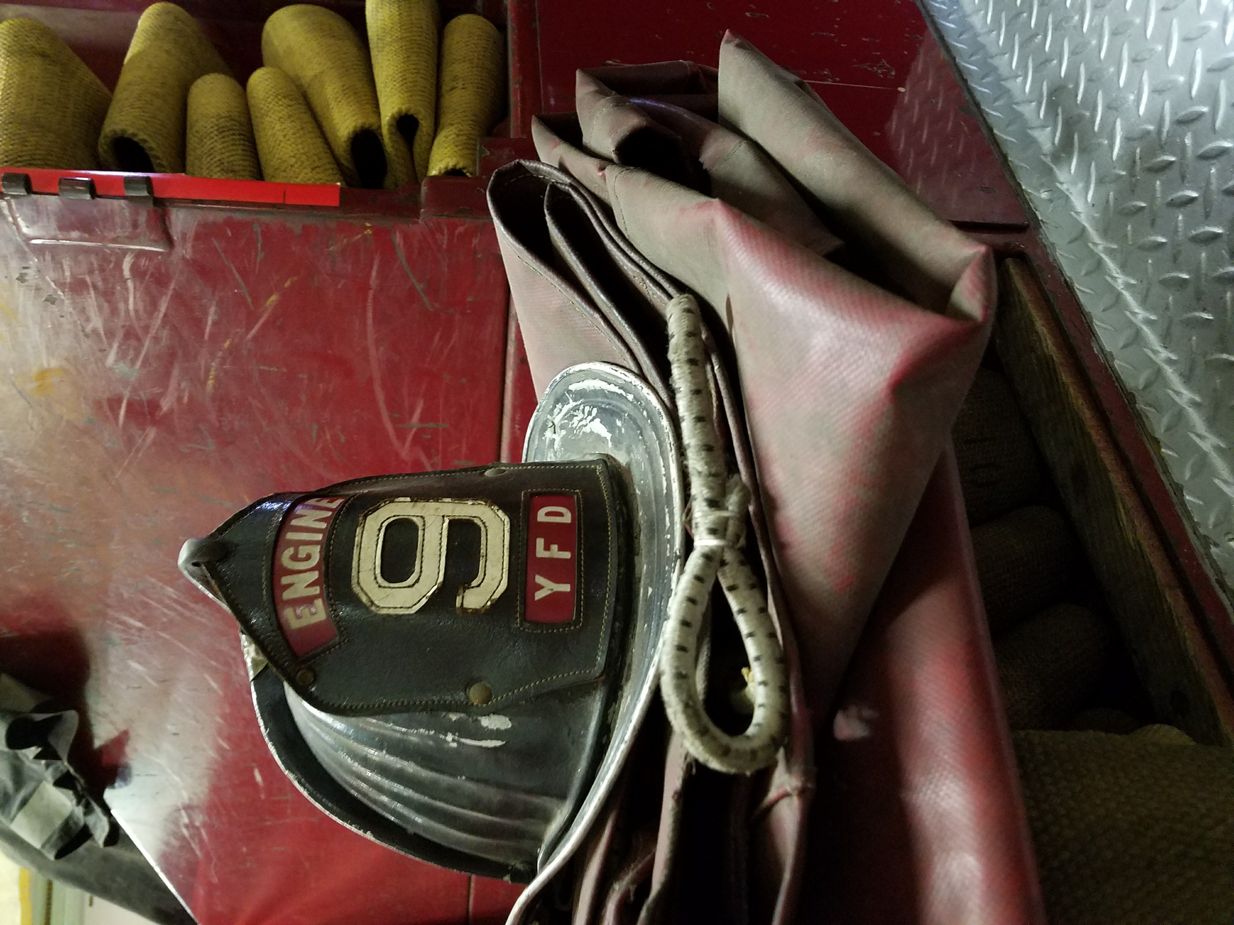 Antique fire helmet and hose