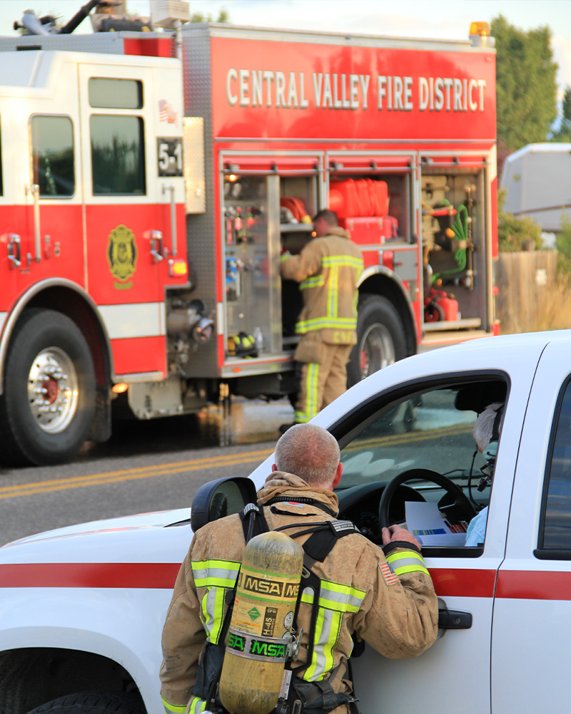 CVFD firefighters standing nearby a firetruck